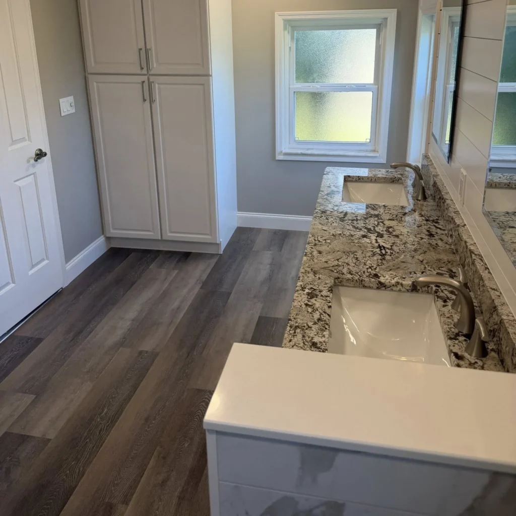 Wooden floor installed in bathroom by Regalbuto Contractors