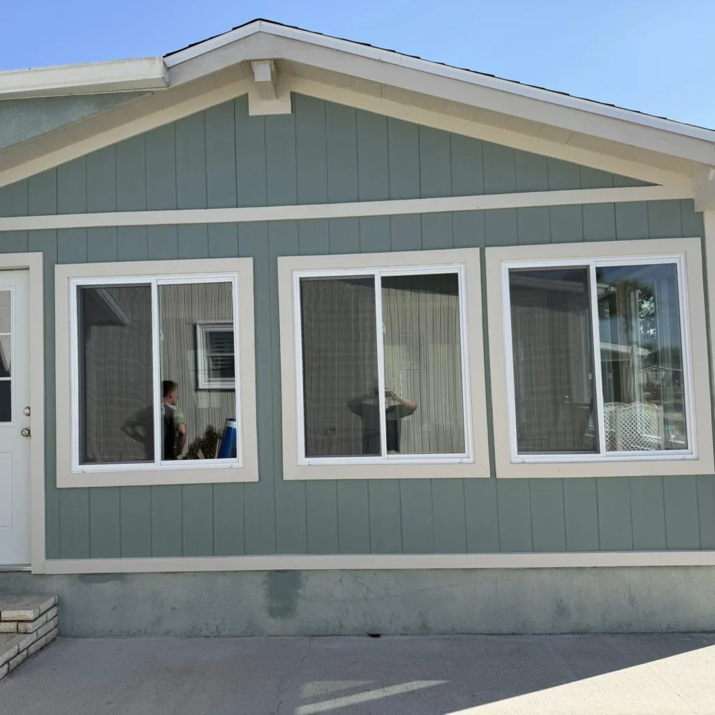 Exterior of an aqua all season room with windows and a door included, installed by Regalbuto Contractors